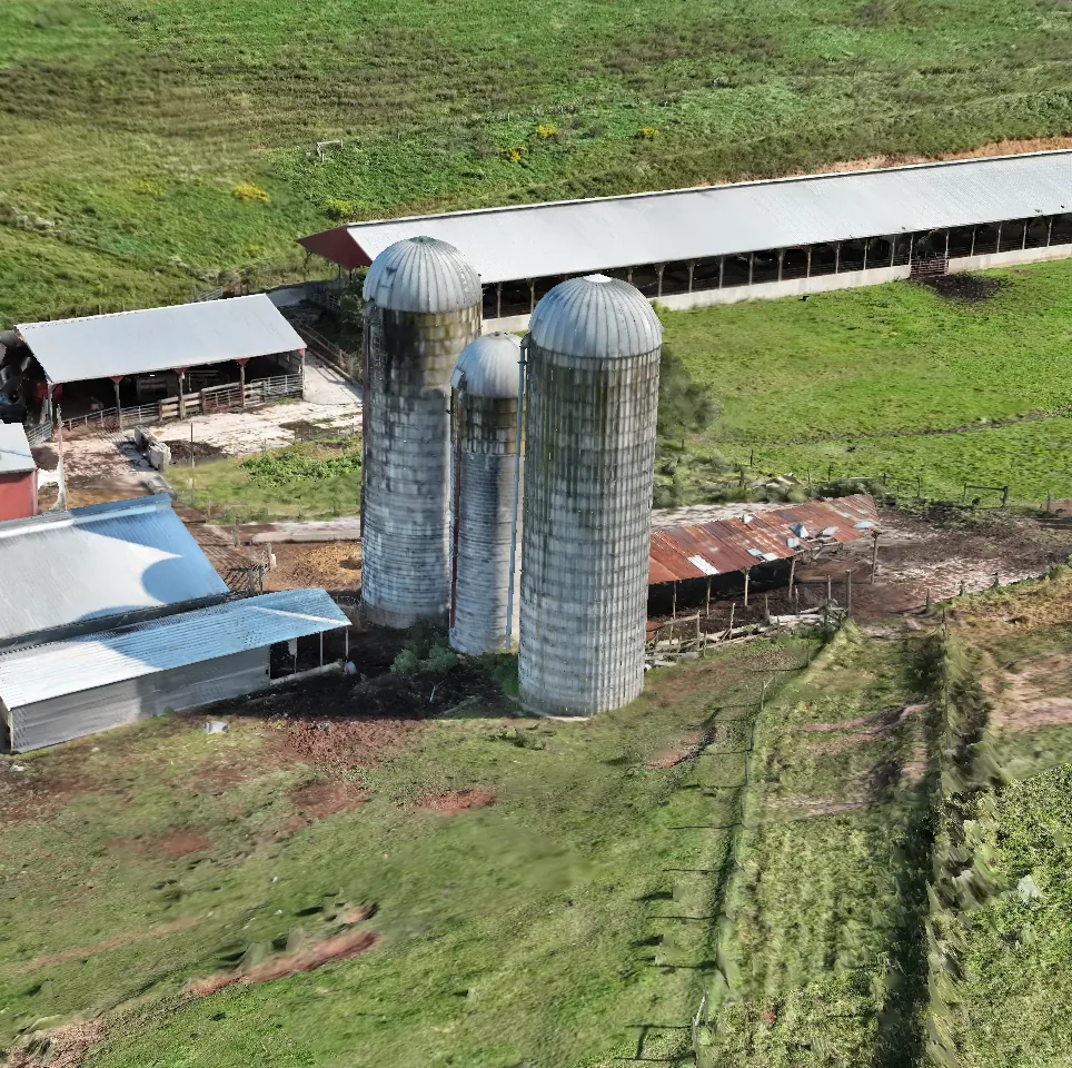 Drone photogrammetry model of a farm with three silos